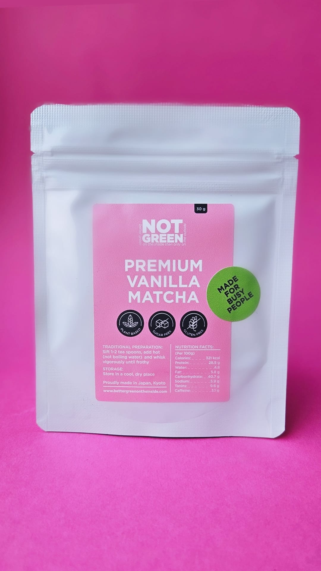Not Green Premium Vanilla Matcha packaging on a pink background